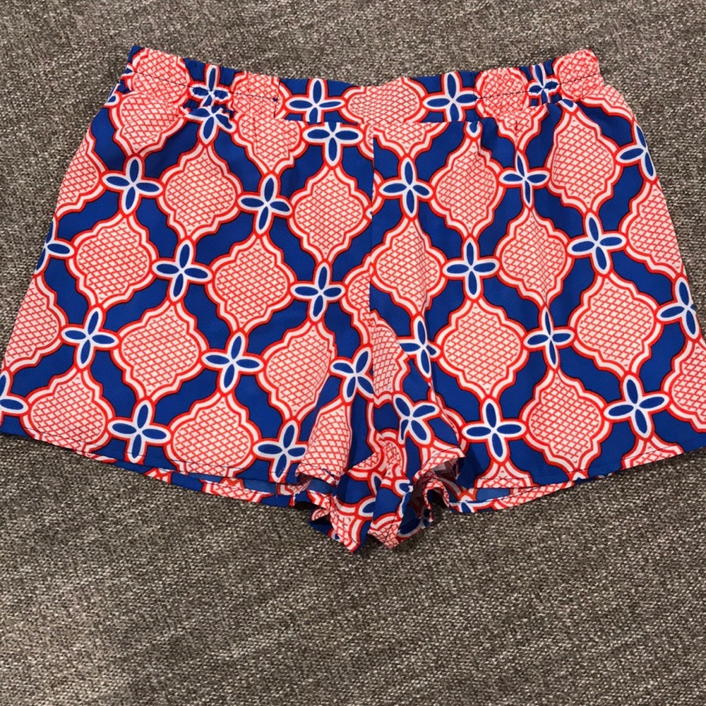 Red and blue patterned shorts. Size Med with tags